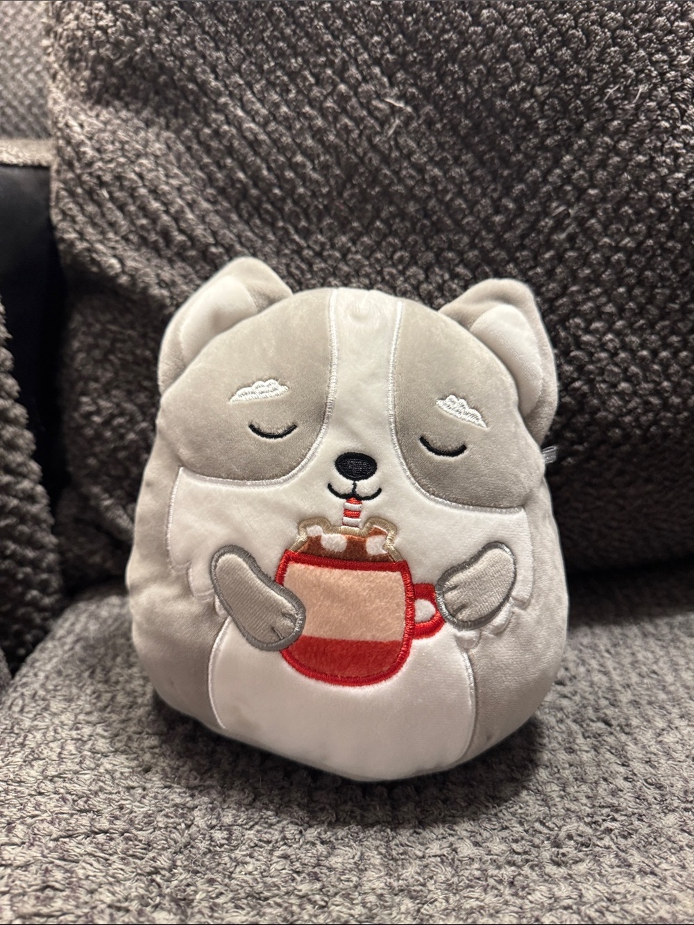 Squishmallows Grey and White Plush Animal Holding Red Mug